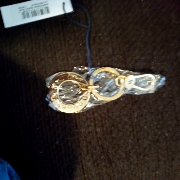 NWT DOONEY AND BOURKE HANGTAG - Picture 1 of 2